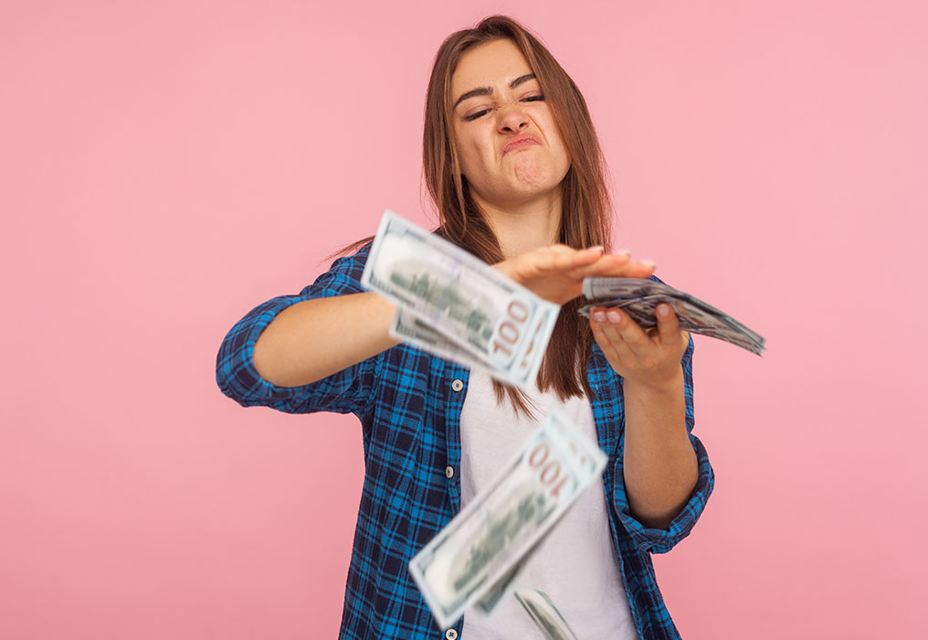 Woman throws around banknotes