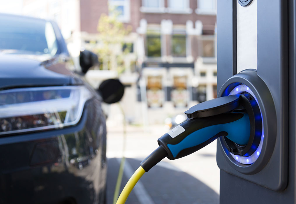 Electric car charging at e-charging station